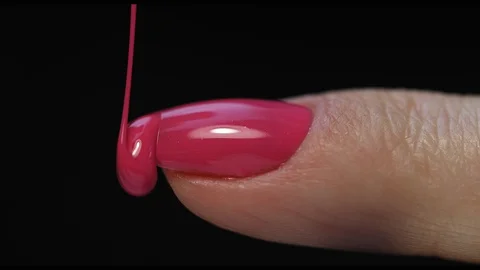 Manicure nail paint. Master applies gel polish on nails  in manicure salon. Stock Footage 124090967
