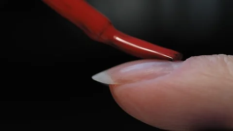 Manicure nail paint. Master applies gel polish on nails  in manicure salon. Stock Footage 124091007