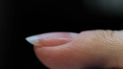 Manicure nail paint. Master applies gel polish on nails  in manicure salon. Stock Footage 124091608