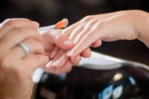 Manicure procedure with pattern and silver nails polish Stockfoto's