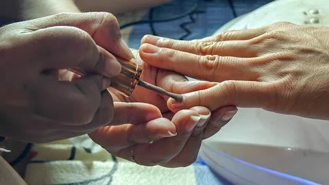 Manicure Process Applying Brown Nail Polish on Female Hands Stock Photos