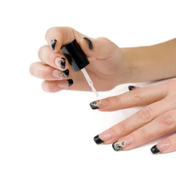 Manicure. The process of lacquer on the nails. Stock Photos