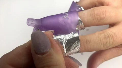 Manicure process, removing cracked gel nail polish from natural nails. Stock Footage 117832241