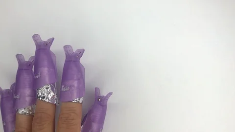  Manicure process, removing gel nail polish from natural nails. Fingers tapping. Stock Footage 117832255