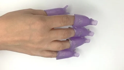 Manicure process, removing gel nail polish from natural nails. Fingers tapping. Stock Footage 117832462