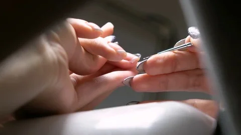 In the manicure salon the manicure master does nails. close-up shot 库存影片 82878981