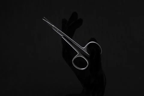 Manicure scissors on a black background 스톡 사진