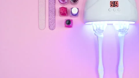 Manicure set and doing manicure on skeletal arms. Stop motion Stock-Footage 166367445