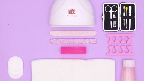 Manicure set layout ordering on purple theme. Stop motion Stock Footage 161507832