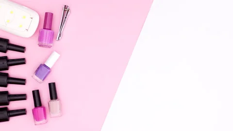 Manicure tools appear on pink side of pink white theme. Stop motion Stock Footage 141175449