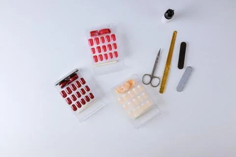 Manicure tools for extension nails, plastic wrap tips, glue and buffers of di Stock Photos