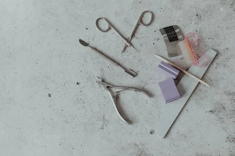 Manicure tools on a light grey background Stock Photos