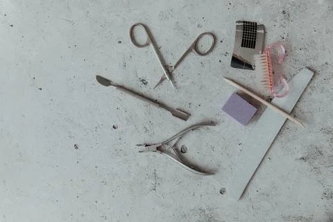 Manicure tools on a light grey background Stock Photos
