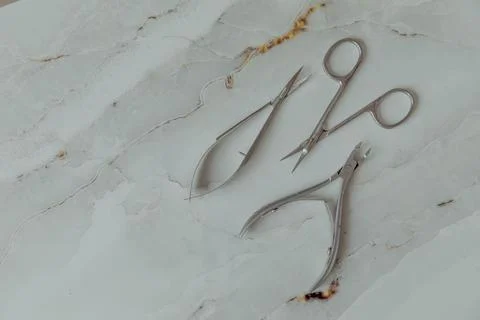 Manicure tools on a light marble background Stock Photos