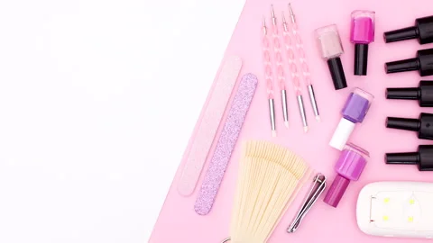 Manicure tools moving on pink side of pink white theme. Stop motion Video stock 141175199