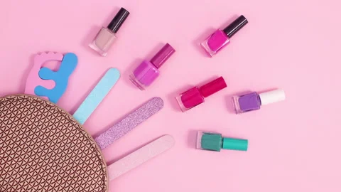 Manicure tools set move in kit on pastel pink background. Stop motion flat lay Stock-Footage 150763597