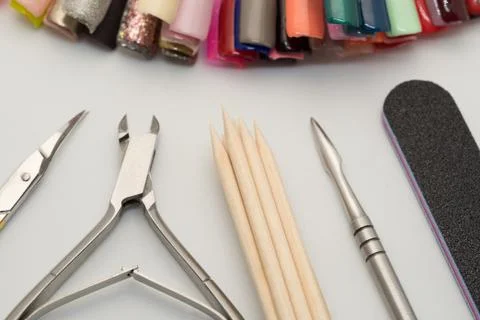 Manicure tools on a white background. Scissors, nail file, sticks, etc. Stock Photos