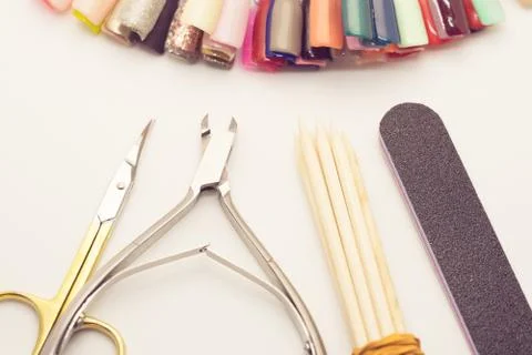 Manicure tools on a white background. Scissors, nail file, sticks, etc. Stock Photos