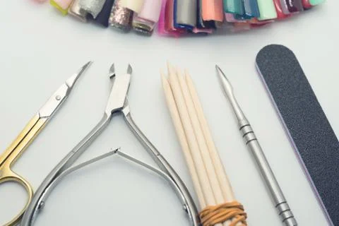 Manicure tools on a white background. Scissors, nail file, sticks, etc. Stock Photos