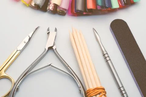 Manicure tools on a white background. Scissors, nail file, sticks, etc. Stock Photos