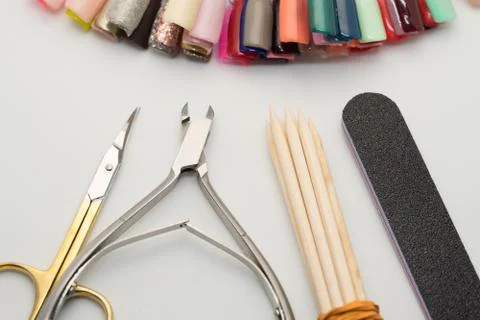 Manicure tools on a white background. Scissors, nail file, sticks, etc. Foto stock