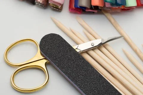 Manicure tools on a white background. Scissors, nail file, sticks, etc. Foto stock