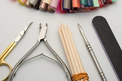 Manicure tools on a white background. Scissors, nail file, sticks, etc. Foto stock