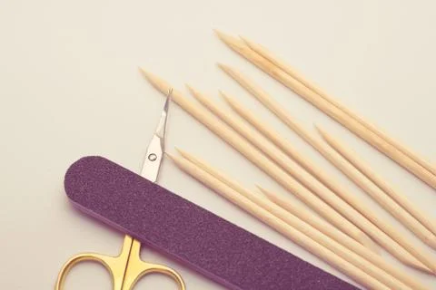 Manicure tools on a white background. Scissors, nail file, sticks, etc. Stock Photos