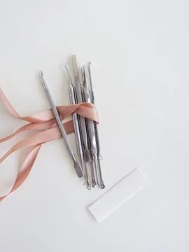 Manicure tools on a white background, there is space for text, top view, wrapped Stock Photos