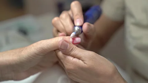 Manicure Tutorial Showing Classic French Design on Mature Hands Video stock 323094455