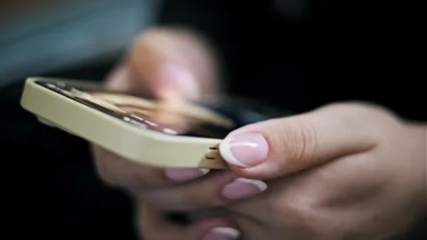Manicured Fingers Scrolling Quickly on Mobile Phone Screen Stock Footage 329914778