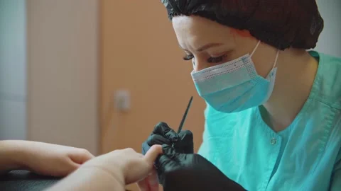 The manicurist carefully processes the nails and prepares them for painting. Stock Footage 152656653