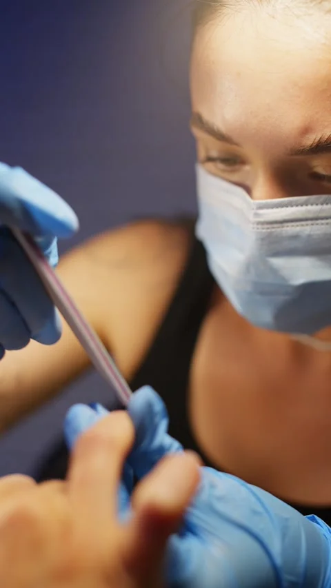 A manicurist cleans a woman's nails. Stock Footage 343541841