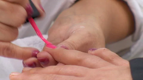 Manicurist Covers Nails With Pink Nail Polish Stock Footage 59576390