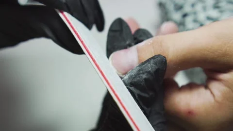 Manicurist cutting nails to a man Stock Footage 169934780