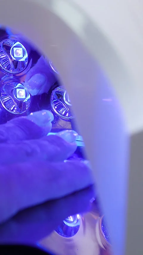 A manicurist is doing a client&amp;#039;s nails at a nail salon. Stock Footage 339781159