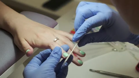 Manicurist files shape of nails. Manicure treatment in beauty salon, manicurist Stock Footage 247062014
