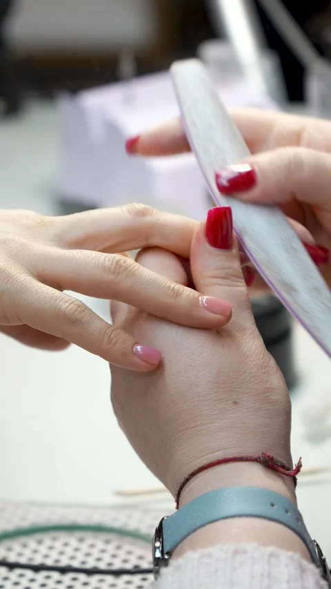 Manicurist Filing Client Nails in Beauty Salon Stock Footage 344782815