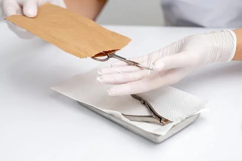 Manicurist hands taking manicure tools Stock Photos