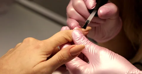 Manicurist makes a manicure with professional tools for manicure. Stock Footage 149896668