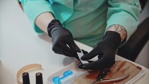 The manicurist prepares a file for working with nails. Stock Footage 152656496