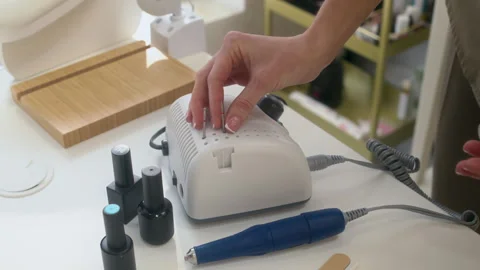 Manicurist Preparing Nail Drill Bits and Tools for Work Stock Footage 312605099