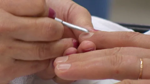 Manicurist Removes The Cuticle Stock Footage 64453370