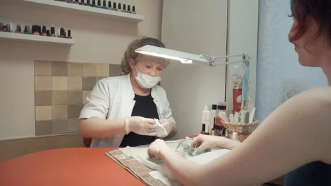 Manicurist talking with client Stock Footage 87825381