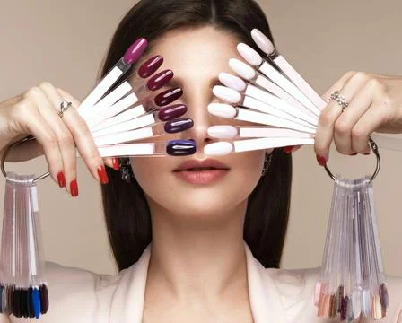 Manicurist in working form with tools in hand. Nail photo content Stock Photos