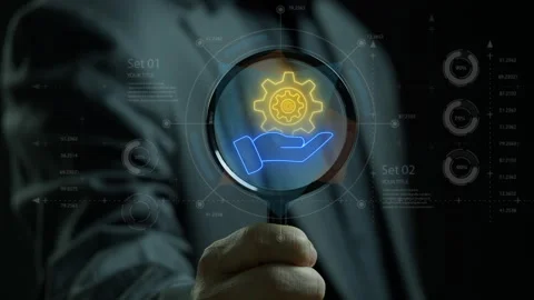 Manifying glass focus on human hand holding cogwheels icon. Stock Footage 313372139