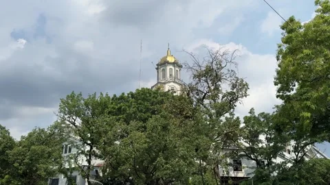 Manila City Hall clock tower through green trees 4K 库存影片 337450991