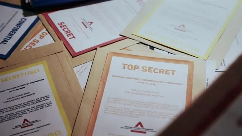 Manila folders with different security clearance labels for top secret documents Video stock 219874494