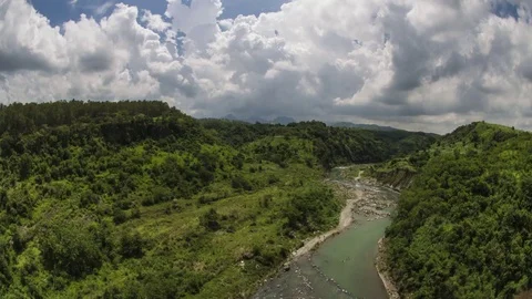 Manila: Stream with Clouds and Trees during Day Stock Footage 70648869