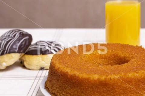 Manioc cake with chocolate candy and juice Stock Photos
